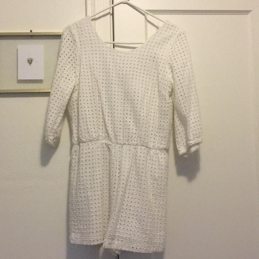 Eyelet romper in white w/tie back. Worn once.